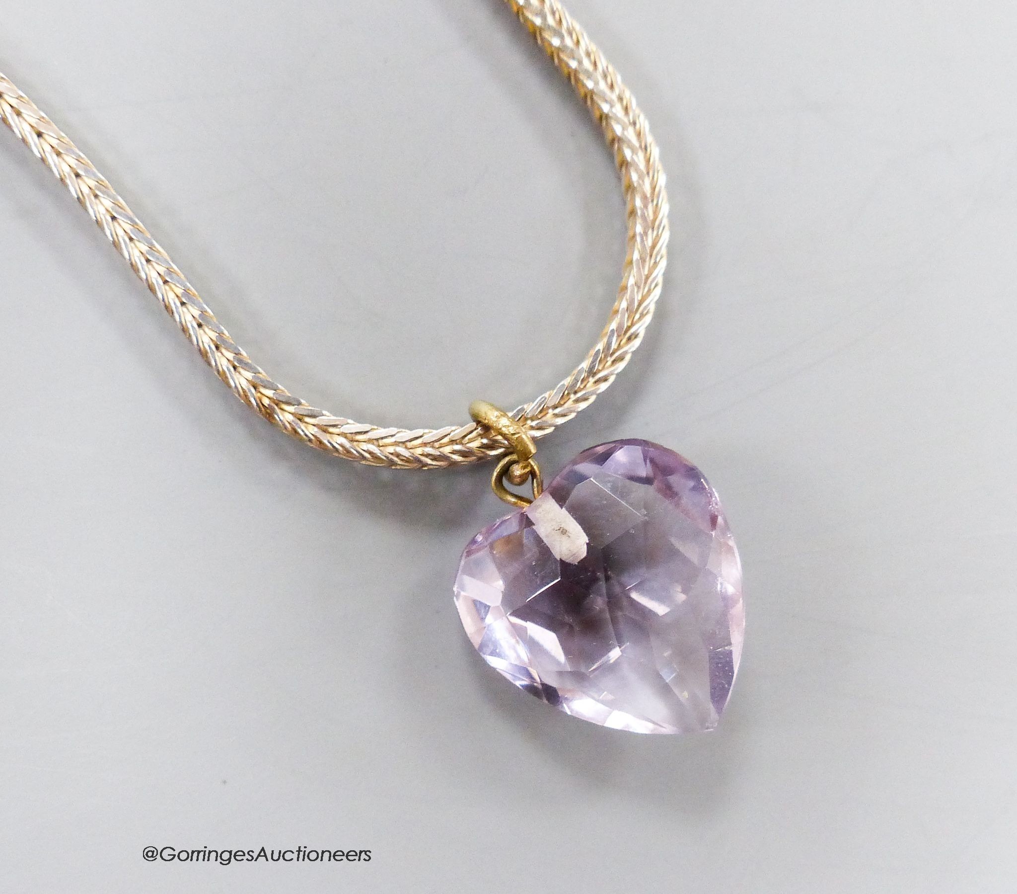 A heart shaped facet cut amethyst pendant, 15mm, on a modern 925 chain.